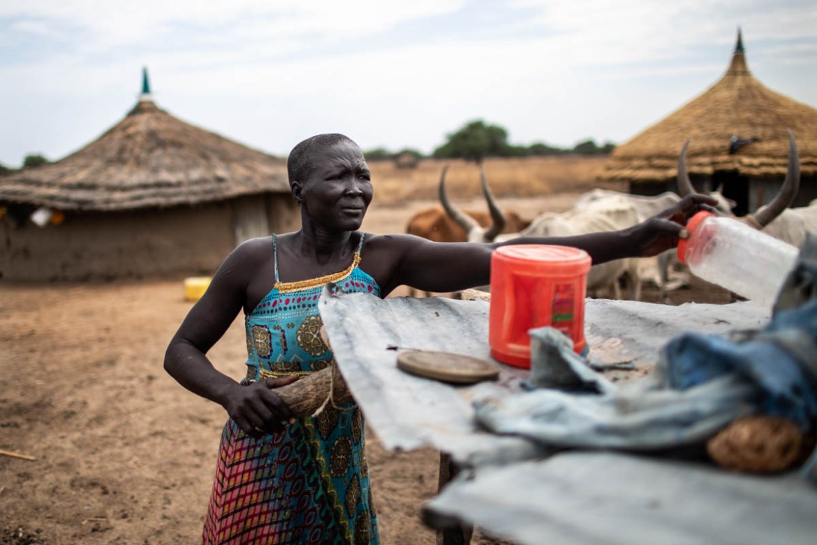 Anyieth Garang puts dishes on a drying rack at the compound where she keeps her family’s cattle in Ruar Leek village, on April 8, 2019. “The real challenge now is that there is no one to take my cattl
