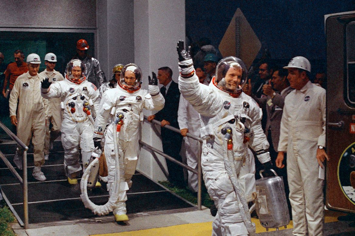 Neil Armstrong, Michael Collins and Buzz Aldrin walk to the van that will take the Apollo 11 crew to the launchpad at Kennedy Space Center on Merritt Island, Florida on July 16, 1969. [File: AP Photo]