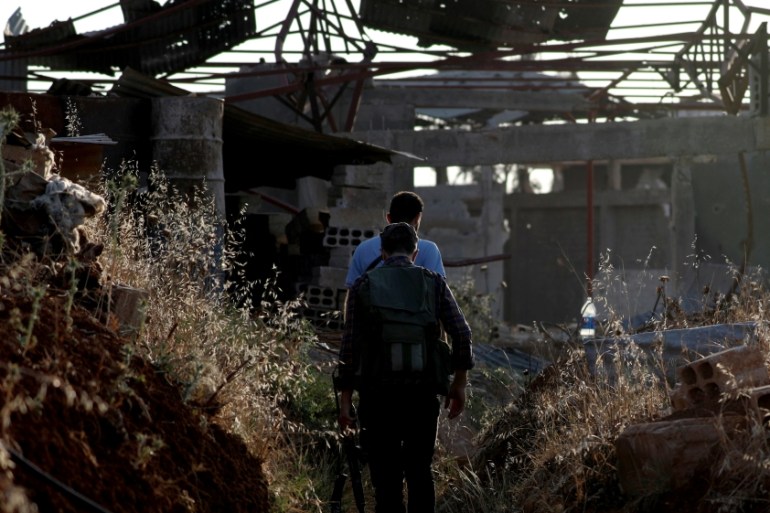 Fighters from the Free Syrian Army are seen in Yadouda area in Daraa