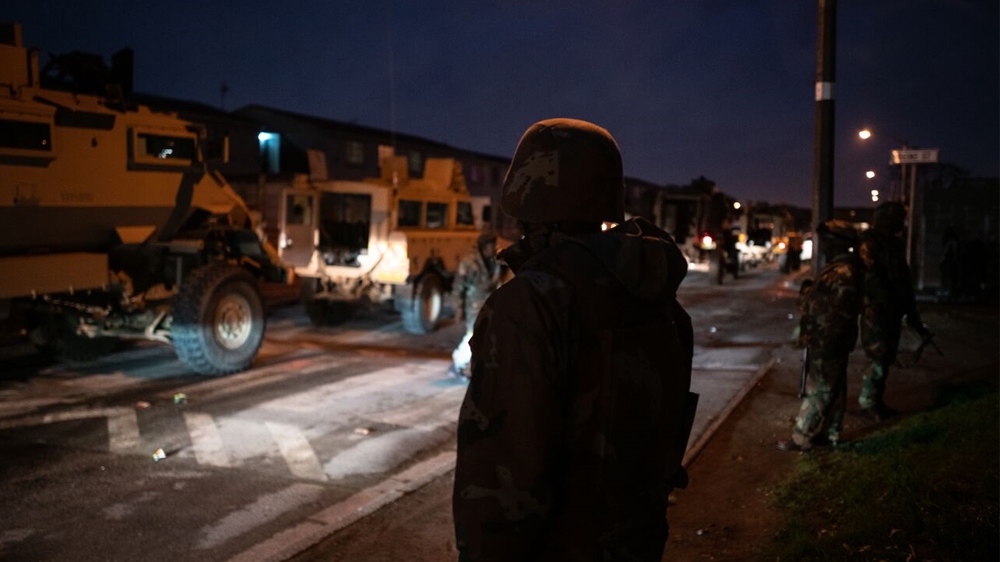 Armoured vehicles in Manenberg, a  heavily gang-afflicted area on the Cape Flats [Shaun Swingler/Al Jazeera]