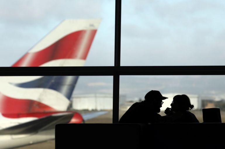 A British Airways Boeing 747 passenger aircraft prepares to take off as passengers wait to board a flight in Cape Town International airport in Cape Town