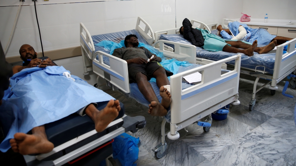 Wounded migrants lie on hospital beds after an air strike hit a detention center for mainly African migrants in Tajoura, in Tripoli Central Hospital