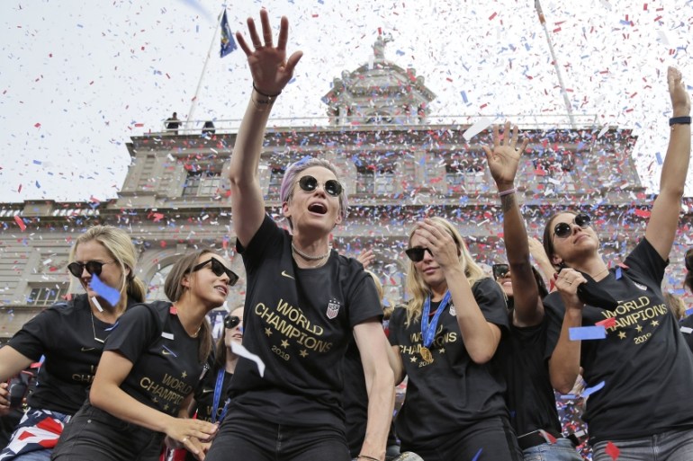 Megan Rapinoe, center, and Alex Morgan, right, celebrates with U.S. women''''s soccer teammates at City Hall after a ticker tape parade, Wednesday, July 10, 2019, in New York. The U.S. national team b