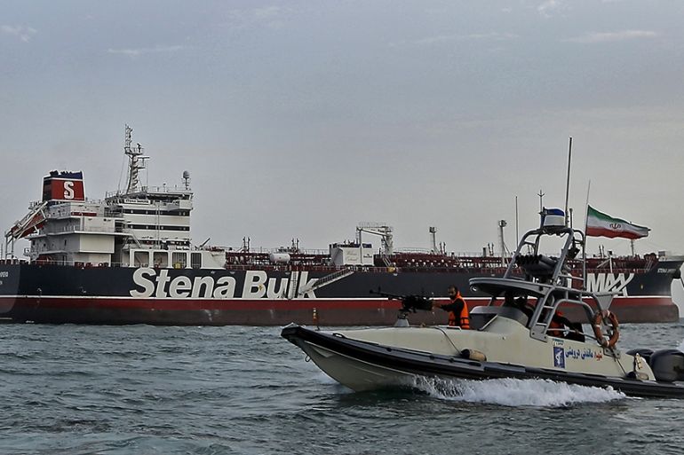 A picture taken on July 21, 2019, shows Iranian Revolutionary Guards patrolling around the British-flagged tanker Stena Impero as it''s anchored off the Iranian port city of Bandar Abbas. - Iran warned