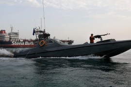 A speedboat of the Iran''s Revolutionary Guard moves around a British-flagged oil tanker Stena Impero, which was seized on Friday by the Guard, in the Iranian port of Bandar Abbas, Sunday, July 21, 201