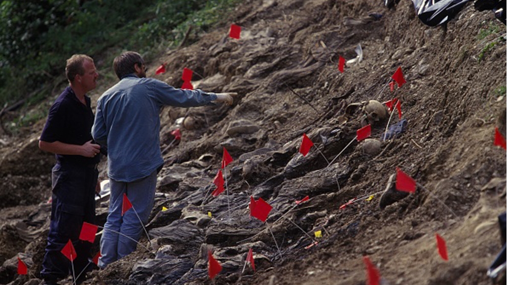 Mass Grave Exhumation near Cerska SREBRENICA, BOSNIA AND HERZEGOVINA - JULY 1996: Mass grave exhumation near Cerska, a year ago the Bosnian Serb army, led by General Ratko Mladic, 