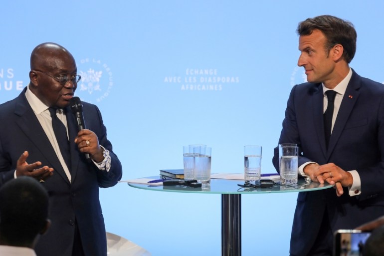 French President Emmanuel Macron (R) listens to Ghanaian President Nana Akufo-Addo during a debate entitled "Parlons d''Afrique" (Let''s talk about Africa)