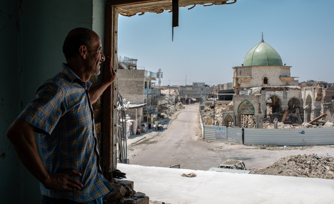 Hussein Abas, watching al Nuri Mosque from his destroyed house in Mosul Hussein''s house is at the heart of the old city of Mosul, which was massively bombed during retaking operations two years ago.