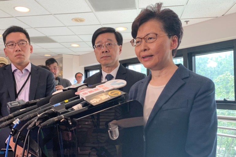 Hong Kong Chief Executive Carrie Lam (R) and Secretary for Security John Lee Ka-chiu speak to media over an extradition bill protest in Hong Kong, China July 15, 2019. REUTERS/Joyce Zhou