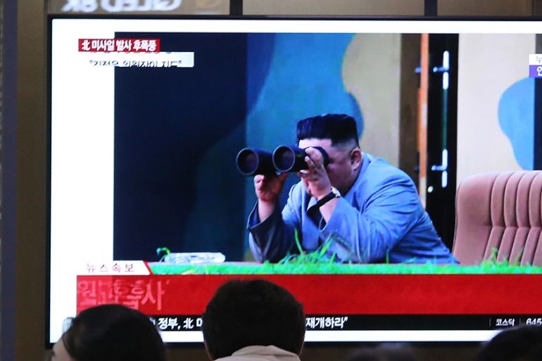 People watch a TV showing an image of North Korean leader Kim Jong Un during a news program at the Seoul Railway Station in Seoul, South Korea, Friday, July 26, 2019. A day after two North Korean miss