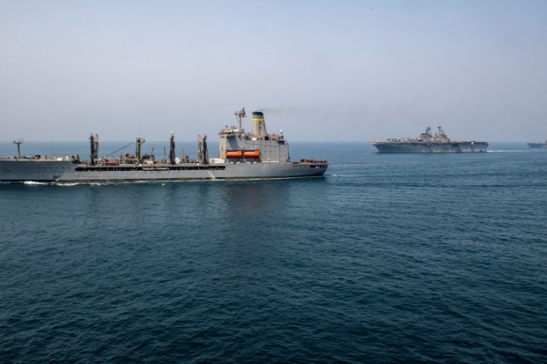 Fleet replenishment oiler USNS Big Horn, amphibious assault ship USS Boxer, and fleet replenishment oiler USNS Tippecanoe transit the Arabian Gulf