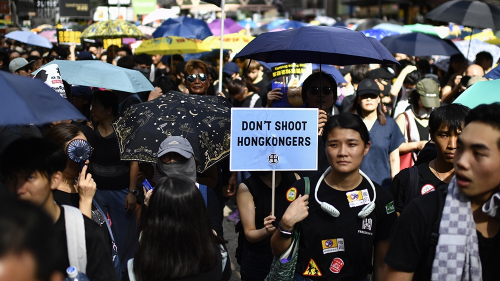 Protesters march against a controversial extradition bill in Hong Kong on July 21, 2019. - Another huge anti-government march kicked off in Hong Kong on July 21 afternoon with seemingly no end in sigh