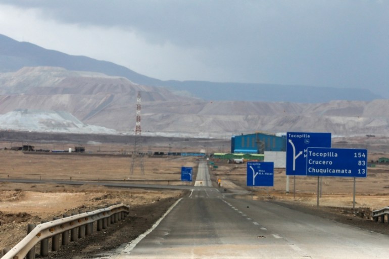 A hole in the road is seen after heavy rains hit north of Chile near Calama