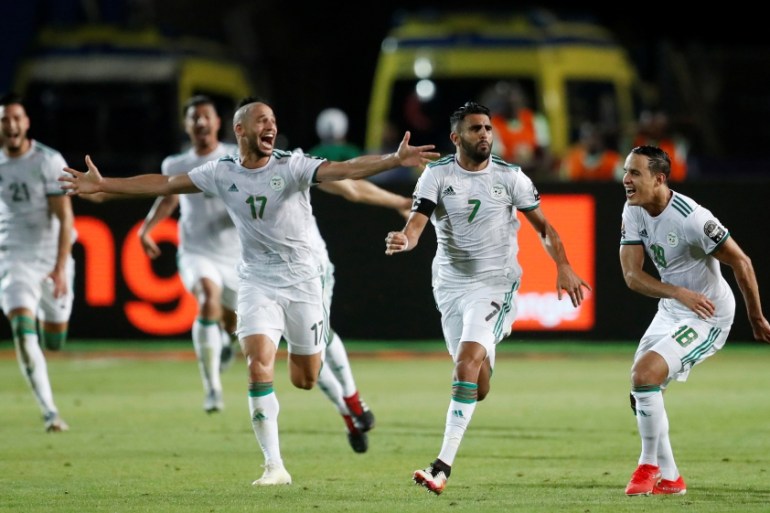 Soccer Football - Africa Cup of Nations 2019 - Semi Final - Algeria v Nigeria - Cairo International Stadium, Cairo, Egypt - July 14, 2019 Algeria''s Riyad Mahrez celebrates scoring their second goal wi
