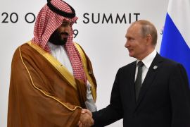 Russia&#39;s President Vladimir Putin shakes hands with Saudi Arabia&#39;&#39;s Crown Prince Mohammed bin Salman during a meeting on the sidelines of the G20 Summit in Osaka, Japan June 29, 2019. [Yuri Kadobnov/Reuters]