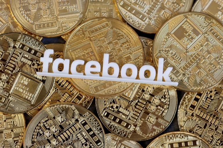 Facebook logo is seen on representations of virtual currency in this illustration picture