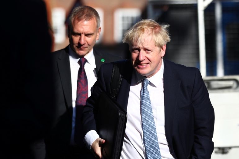 Boris Johnson is seen outside his office in London