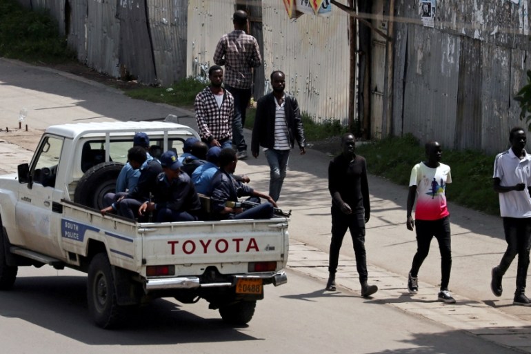 Armed security officers patrol the street during a clash between a Sidama youth and security officers after they declared their own region in Hawassa, Ethiopia July 18, 2019