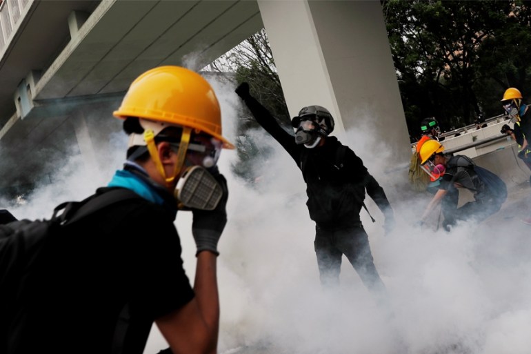 DATE IMPORTED: 27 July, 2019 Demonstrators react to a tear gas during a protest against the Yuen Long attacks in Yuen Long, New Territories, Hong Kong, China July 27, 2019. REUTERS/Tyrone Siu
