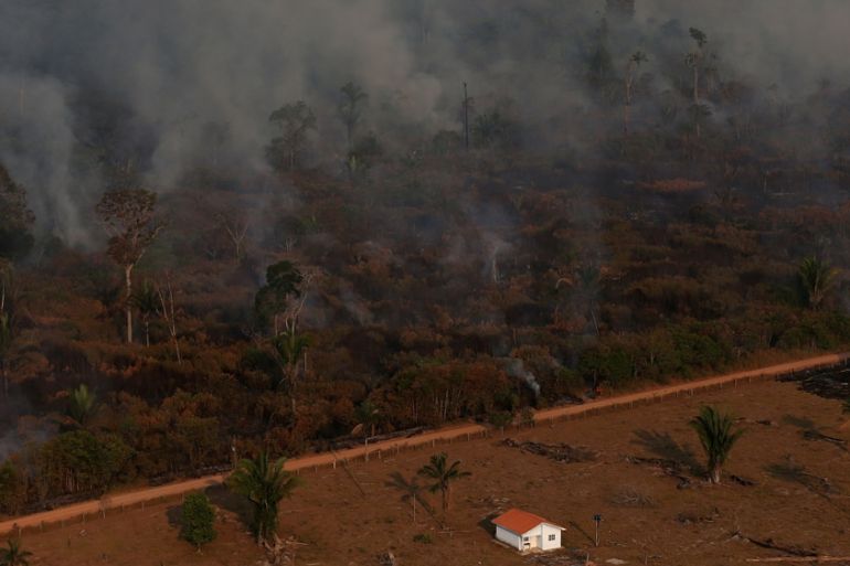 An aerial view of a burning tract of Amazon jungle as it is cleared by loggers and farmers near Porto Velho