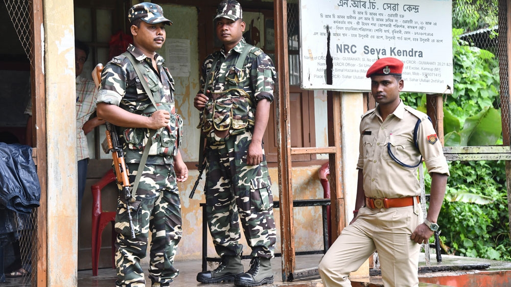 Security personnel stand guard at a NRC centre in Guwahati, India