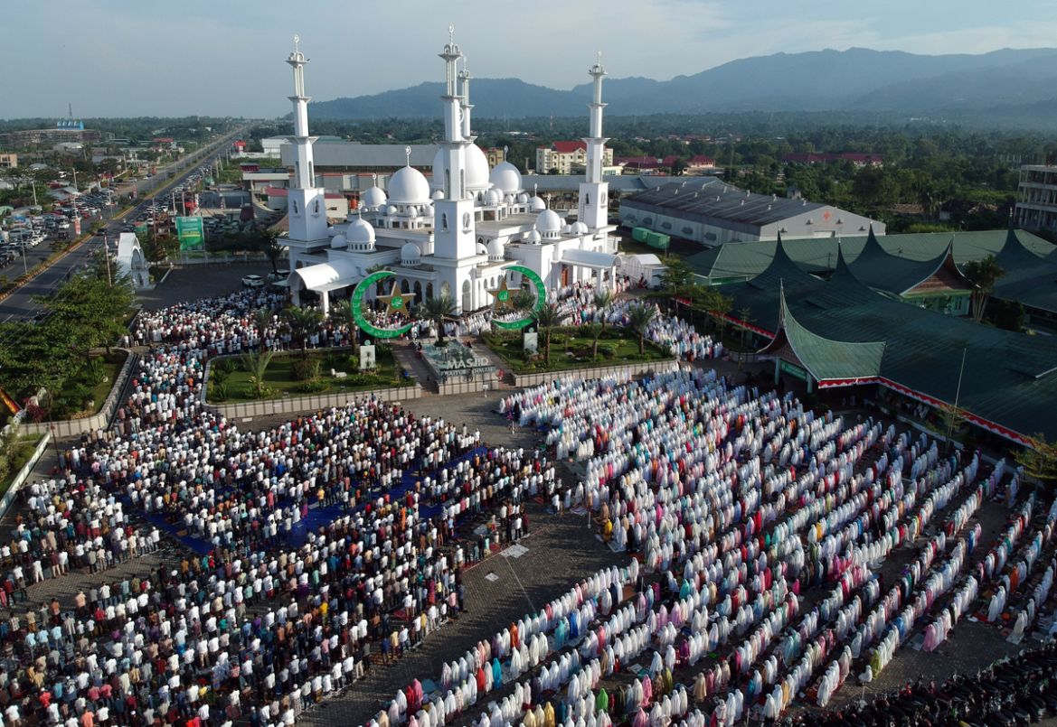 An aerial picture of Indonesian Muslims offering Eid al-Adha prayers at Baiturrahmah mosque in Padang, West Sumatra province, Indonesia, August 11, 2019 in this photo taken by Antara Foto. Antara Fot