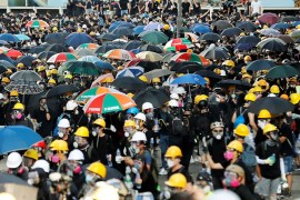 Protesters carry umbrellas as they attends a demonstration in support of the city-wide strike and to call for democratic reforms in Hong Kong, China, August 5, 2019. . REUTERS/Kim Kyung-Hoon -