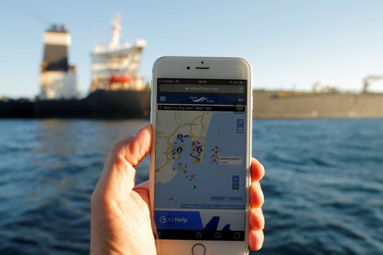 The position of the Iranian oil tanker Adrian Darya 1, formerly named Grace 1, is seen on a mobile phone as it sits anchored after the Supreme Court of the British territory lifted its detention or