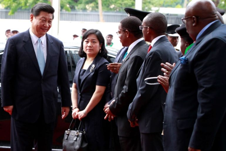 China''s President Xi Jinping (L) arrives for the opening ceremony of