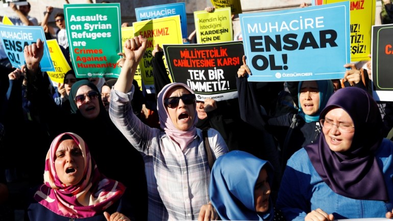Demonstrators shout slogans in support of Syrian refugees during a protest against Turkish government''s recent refugee policies in Istanbul