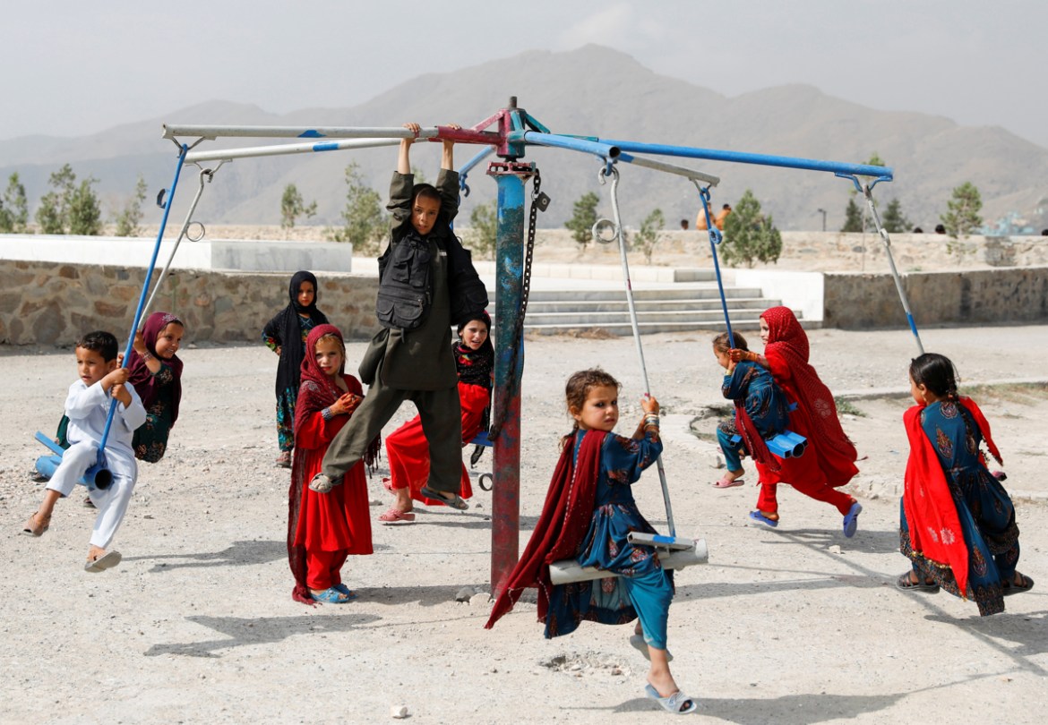 Afghan children ride on swings during the first day of the Muslim holiday of the Eid al-Adha, in Kabul, Afghanistan August 11, 2019.REUTERS/Mohammad Ismail