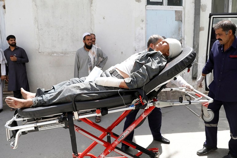An injured man is placed in an ambulance at a hospital after a blast in Kabul, Afghanistan, August 7, 2019. REUTERS/Mohammad Ismail