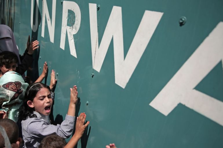 In this Sunday, Aug. 16, 2015 file photo, a Palestinian school girl chants slogans during a demonstration against a U.N. Relief and Works Agency (UNRWA) funding gap that could keep about 500,000 Pales