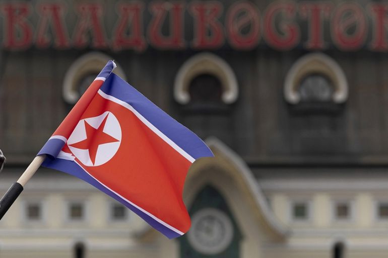 North Korea flag waving in Russia April 2019