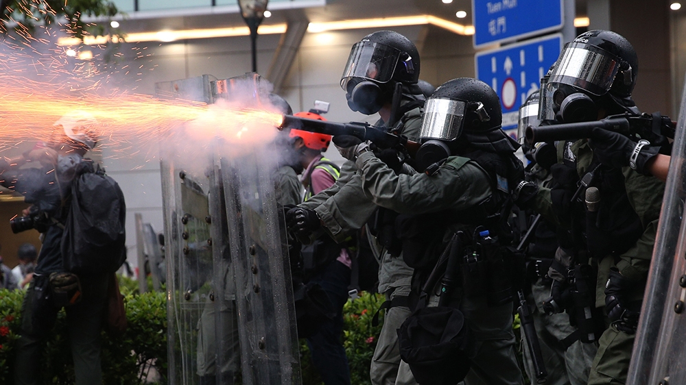  Riot police fire tear gas as protesters take part in an anti-government rally in Kwai Fung and Tsuen Wan, Hong Kong, China, 25 August 2019. The protests were triggered last June by an extradition bil