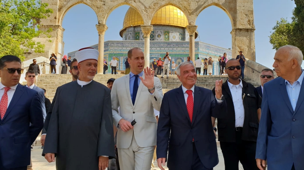 Britain's Prince William, accompanied by a group including Sheikh Azzam al-Khatib, director of the Islamic Waqf in Jerusalem, tours the compound known to Muslims as Noble Sanctuary