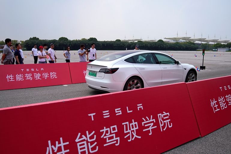 People attend a Tesla performance driving school event at Shanghai International Circuit in Shanghai, China, August 22, 2019. Picture taken August 22, 2019