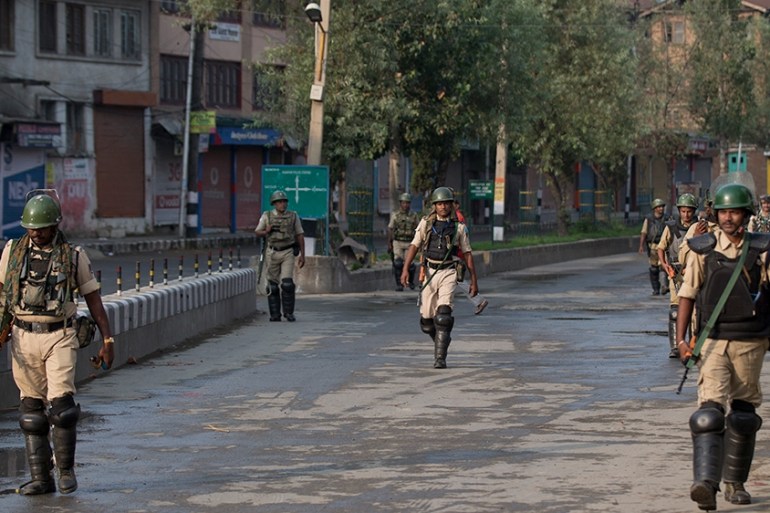 Indian Paramilitary soldiers patrol during curfew in Srinagar, Indian controlled Kashmir, Wednesday, Aug. 7, 2019. Authorities in Hindu-majority India clamped a complete shutdown on Kashmir as they sc