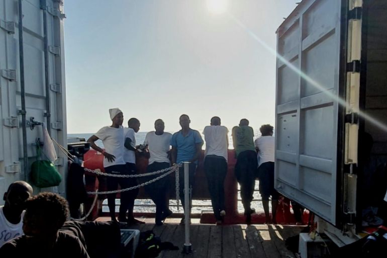 Rescued migrants rest aboard the Ocean Viking, run by French charities Medecins Sans Frontieres and SOS Mediterranee