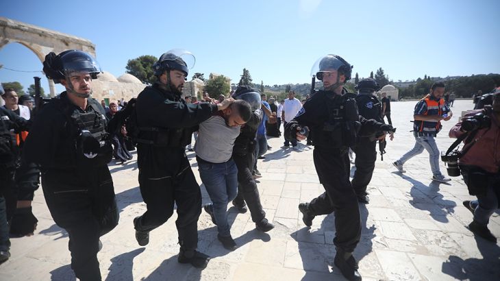 Israeli police arrests a Palestinian worshipper at al-Aqsa mosque compound in Jerusalem, Sunday, Aug 11, 2019.(AP Photo/Mahmoud Illean)