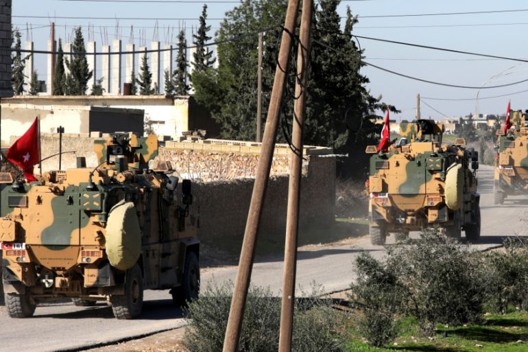Turkish military vehicles drive at Manbij countryside