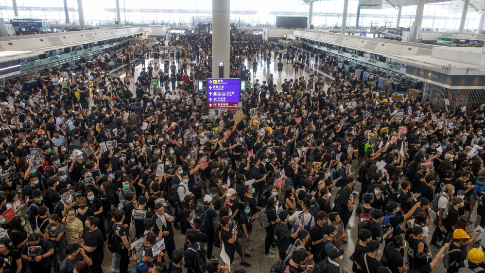 Anti-extradition bill protesters rally at the departure hall of Hong Kong airport in Hong Kong
