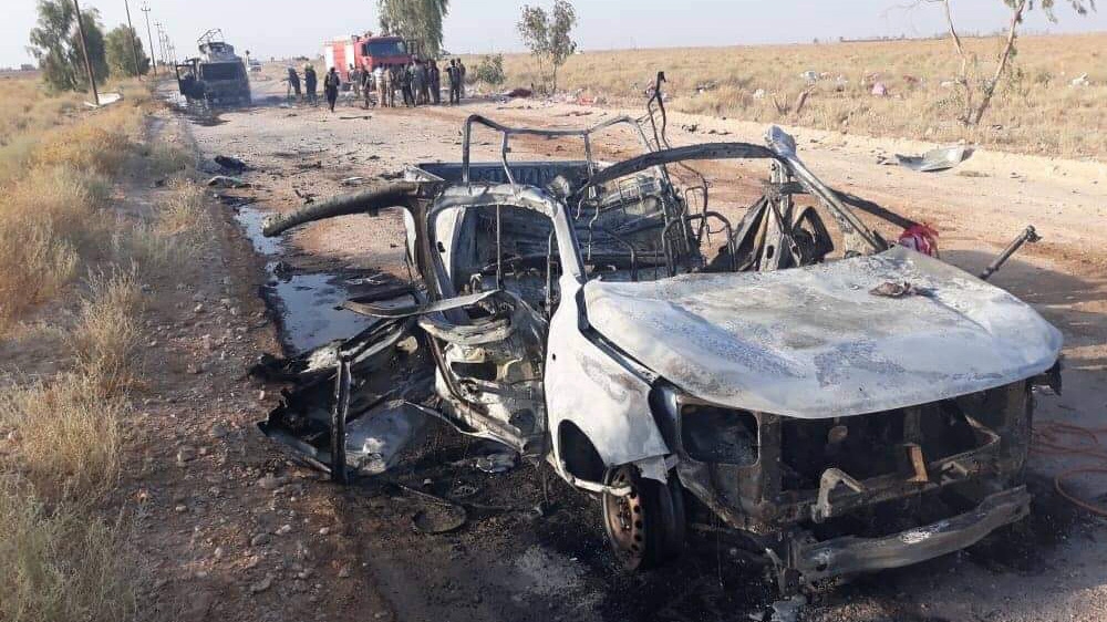 A handout picture released by the Hashed al-Shaabi force shows the wreckage of a vehicle at the site of an unclaimed drone attack near Iraq's western border with Syria on August 25, 2019. Two paramil