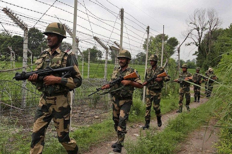 ndia’s Border Security Force (BSF) soldiers patrol near the India-Pakistan international border fencing at Garkhal in Akhnoor, 35 kilometers (22 miles) west of Jammu, India, Tuesday, Aug.13,2019. (AP