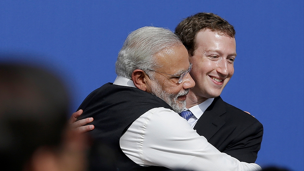FILE - In this Sept. 27, 2015, file photo, Facebook CEO Mark Zuckerberg, right, hugs Prime Minister of India Narendra Modi at Facebook in Menlo Park, Calif. U.S. President Donald Trump should have bee