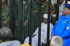Sudan''s deposed military ruler Omar al-Bashir sits in a defendant''s cage during the opening of his corruption trial in Khartoum on August 19, 2019. - Bashir has admitted to receiving $90 million in ca