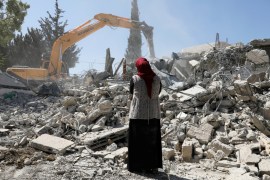 Fawzia stands on the ruins of her house, after her Palestinian he lost a land ownership case in Israeli courts