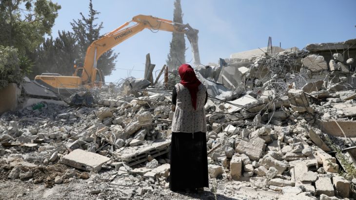 Fawzia stands on the ruins of her house, after her Palestinian he lost a land ownership case in Israeli courts