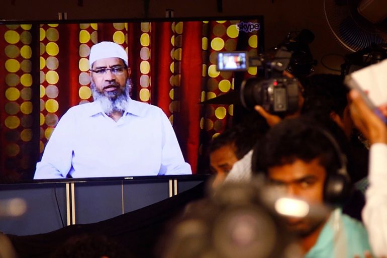 Indian journalists listen to a video conference of controversial Islamic preacher and the founder of Islamic Research Foundation, Zakir Naik, in Mumbai, India, Friday, July 15, 2016. Naik, who is pres