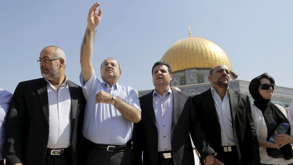 Israeli Arab lawmakers from the Joint Arab List (from L to R) Osama Saadi, Ahmed Tibi, Ayman Odeh, Masud Ganaim and Haneen Zoabi stand in front of the Dome of the Rock during a visit to the compound k